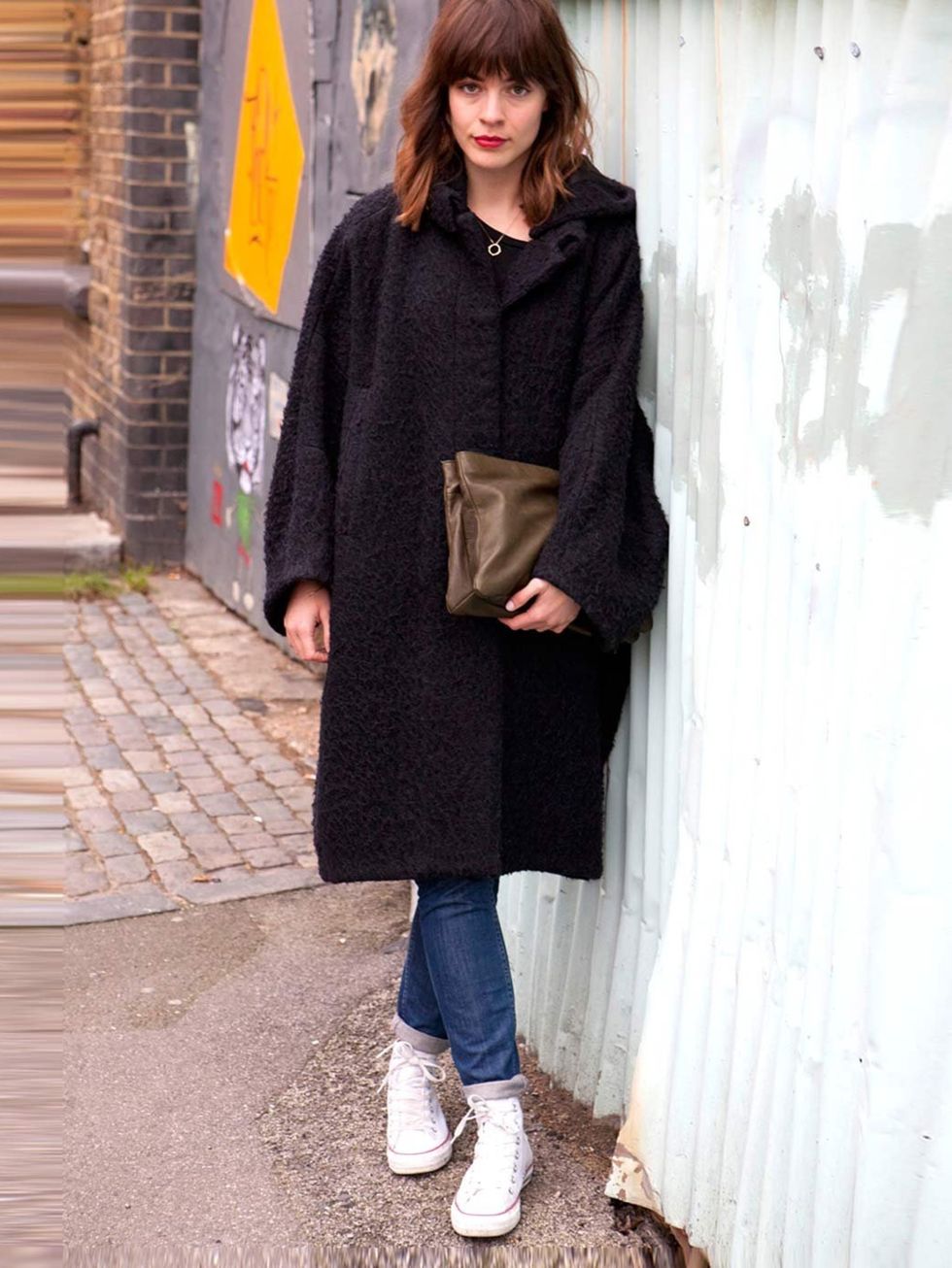 <p>Kate, 27, Assistant Buyer.Acne coat, Cos jeans and bag, Converse trainers.</p>