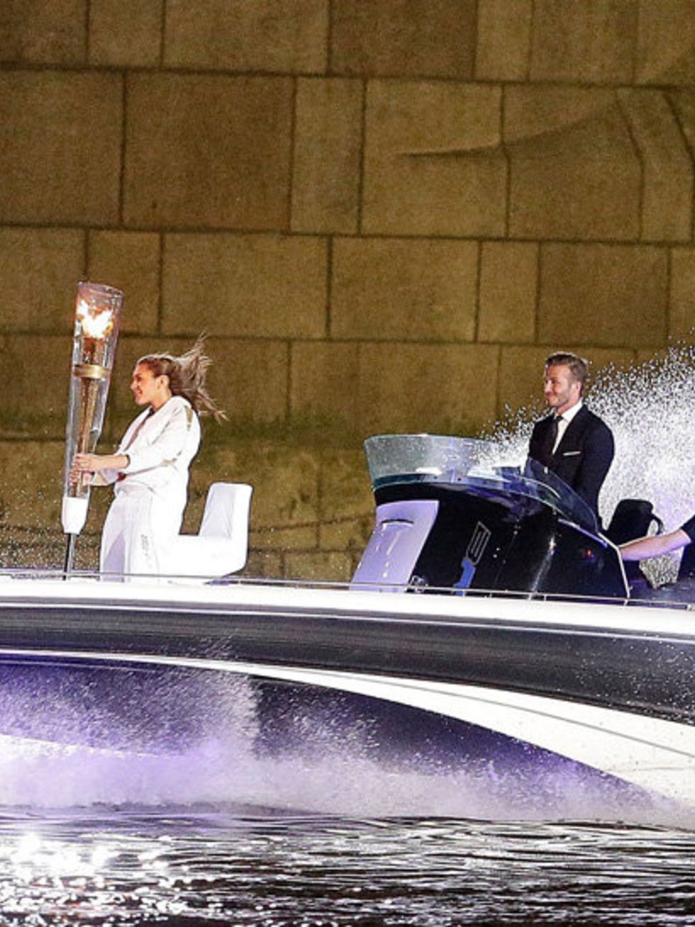 <p>David Beckham is the captain of the ship as he drives a speedboat with the Olympic flame down the river Thames as part of the 2012 Olympic Opening Ceremony Celebrations.</p>