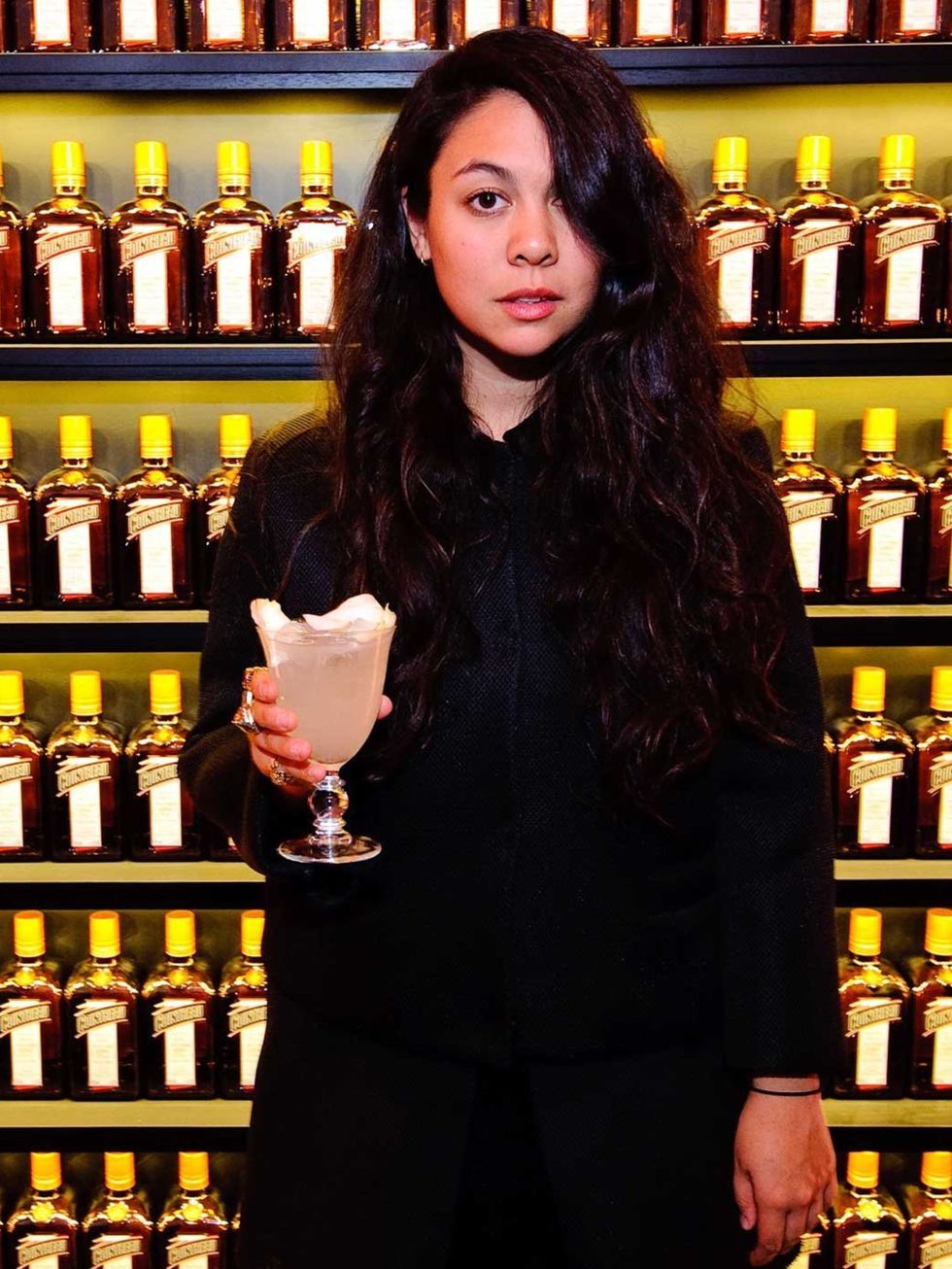 <p>Simone poses with her specially created cocktail: Cointreau Fizz Wild Rose.</p>