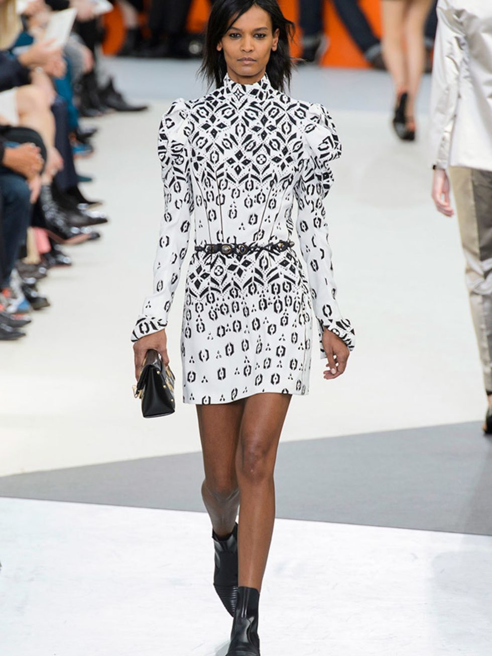 <p>LOUIS VUITTON</p>

<p>Everything about this look says Nicholas Ghesquières Louis Vuitton, and his obsession with retro-futurism. Take a 1890s sleeve, give it a 1980s dress shape, throw an abstract LV monogram print on it, wear it with a flat, black po
