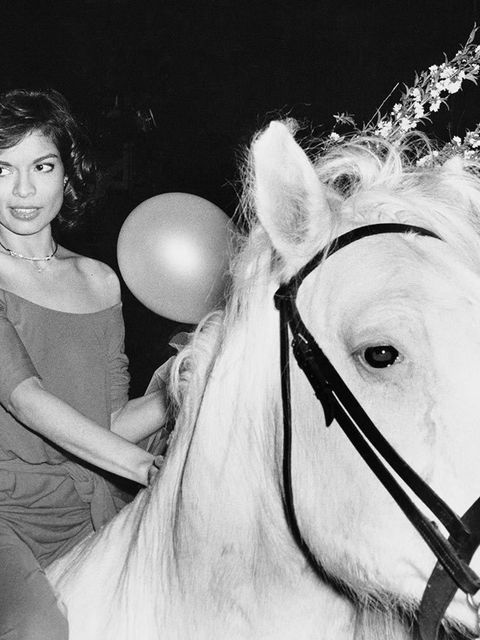 <p>Bianca Jagger in Studio 54 on a white horse in 1977 wearing Manolo Blahnik shoes.</p>