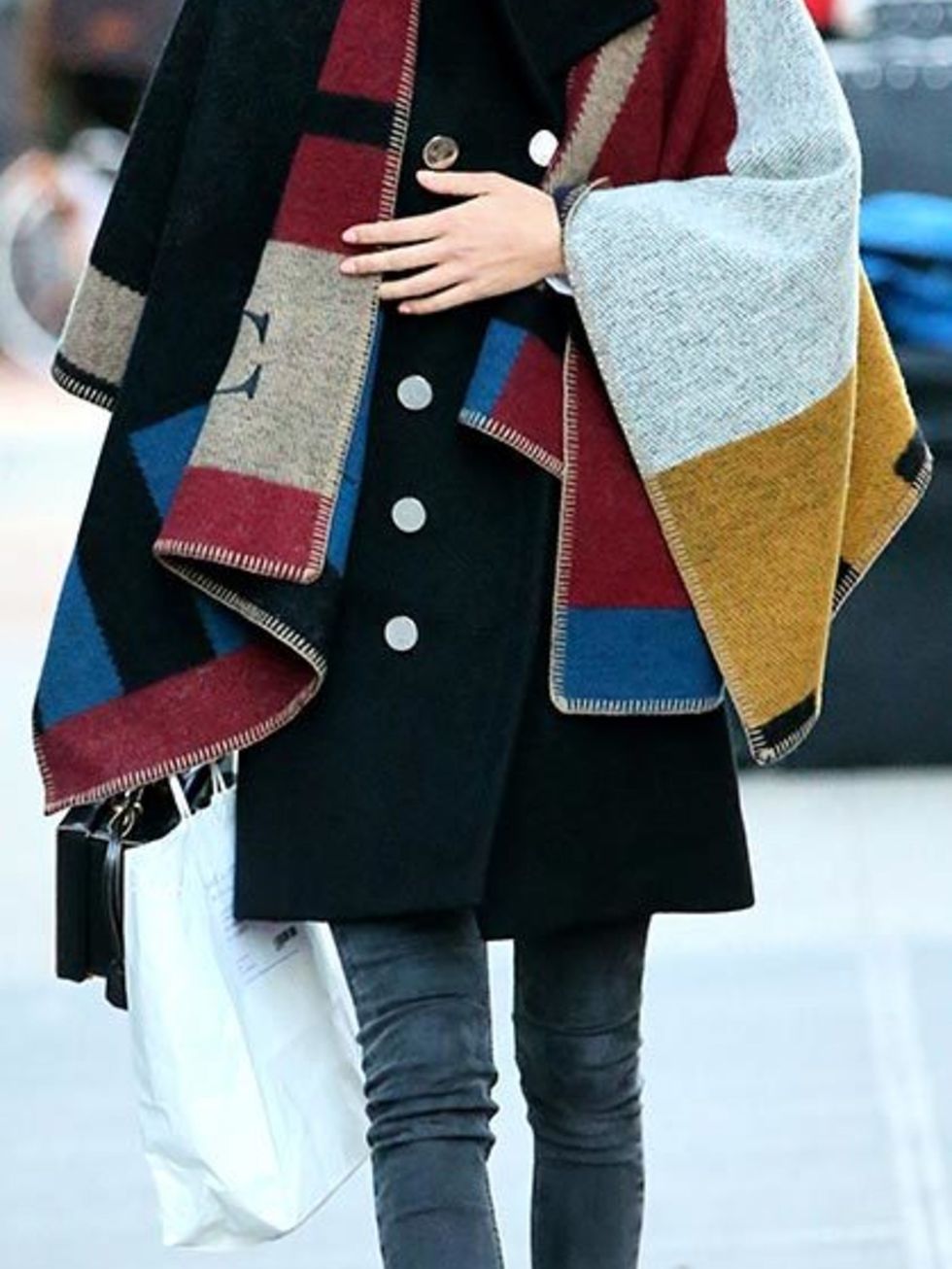 <p><a href="http://www.elleuk.com/fashion/celebrity-style/alexa-chung-s-style-file">Alexa Chung</a> wears the Burberry poncho while out and about in New York, November 2014.</p>