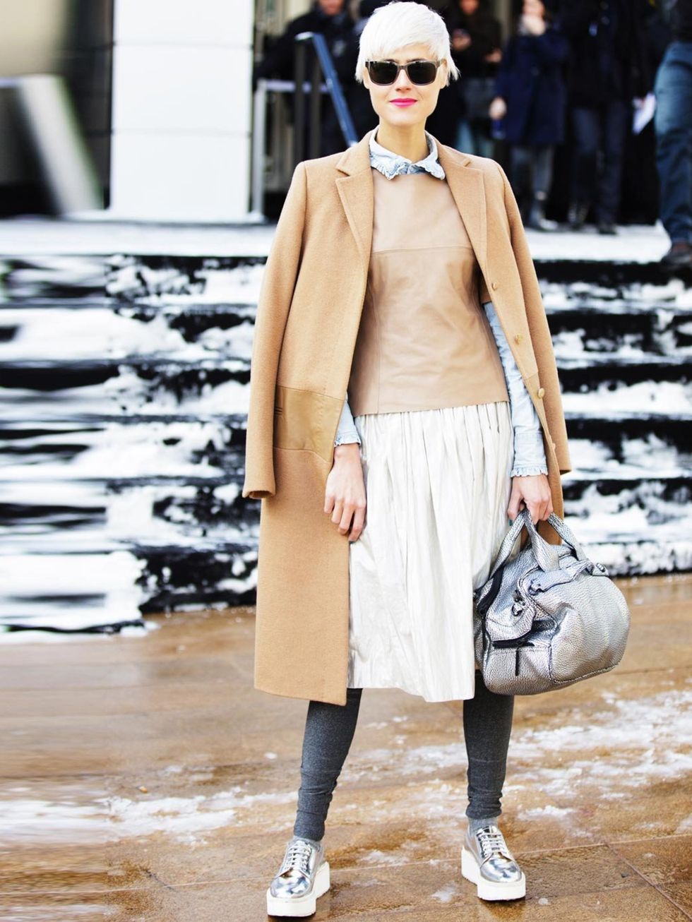 <p>A very feminine coat and skirt get a sporty edge with statement trainers, USA.</p>