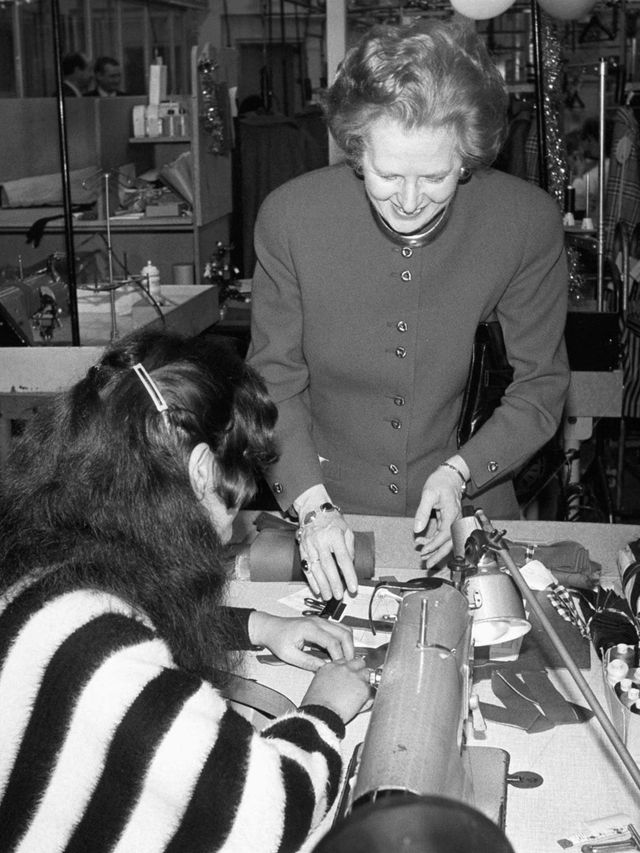 <p>Margaret Thatcher on a visit to an Aquascutum factory in 1987</p>