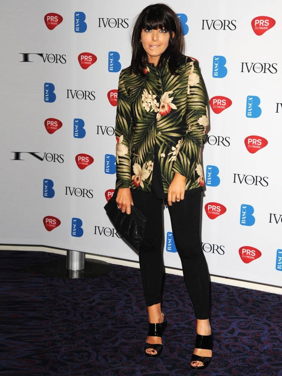 <p>Claudia Winkleman wears bold leaf print jacket and black tights to Ivor Novello Awards</p>