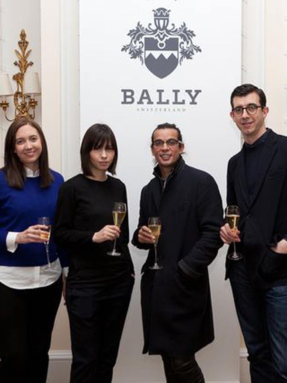 <p>CSM students Alice Bastin and Mei Lim Cooper taost to their collaboration with Bally's Creative Directors Micheal Herz and Graeme Fidler</p>