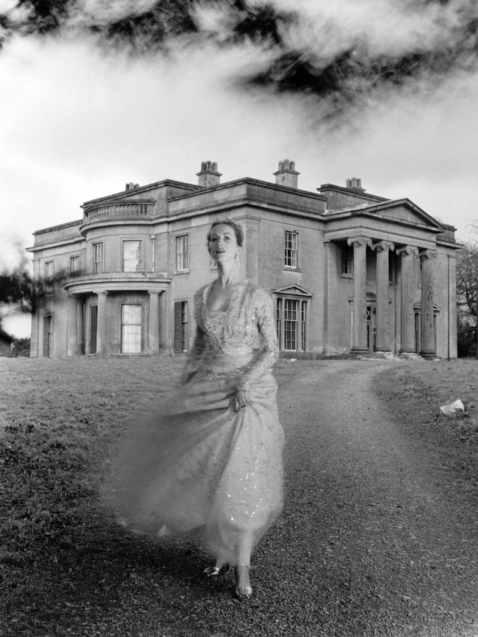 <p>Della Oake wearing a Norman Hartnell gown in Clytha Park, 1951.</p>