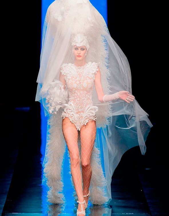 Human leg, Veil, Bridal veil, Foot, Costume design, Ankle, Embellishment, Transparent material, See-through clothing, Flesh, 