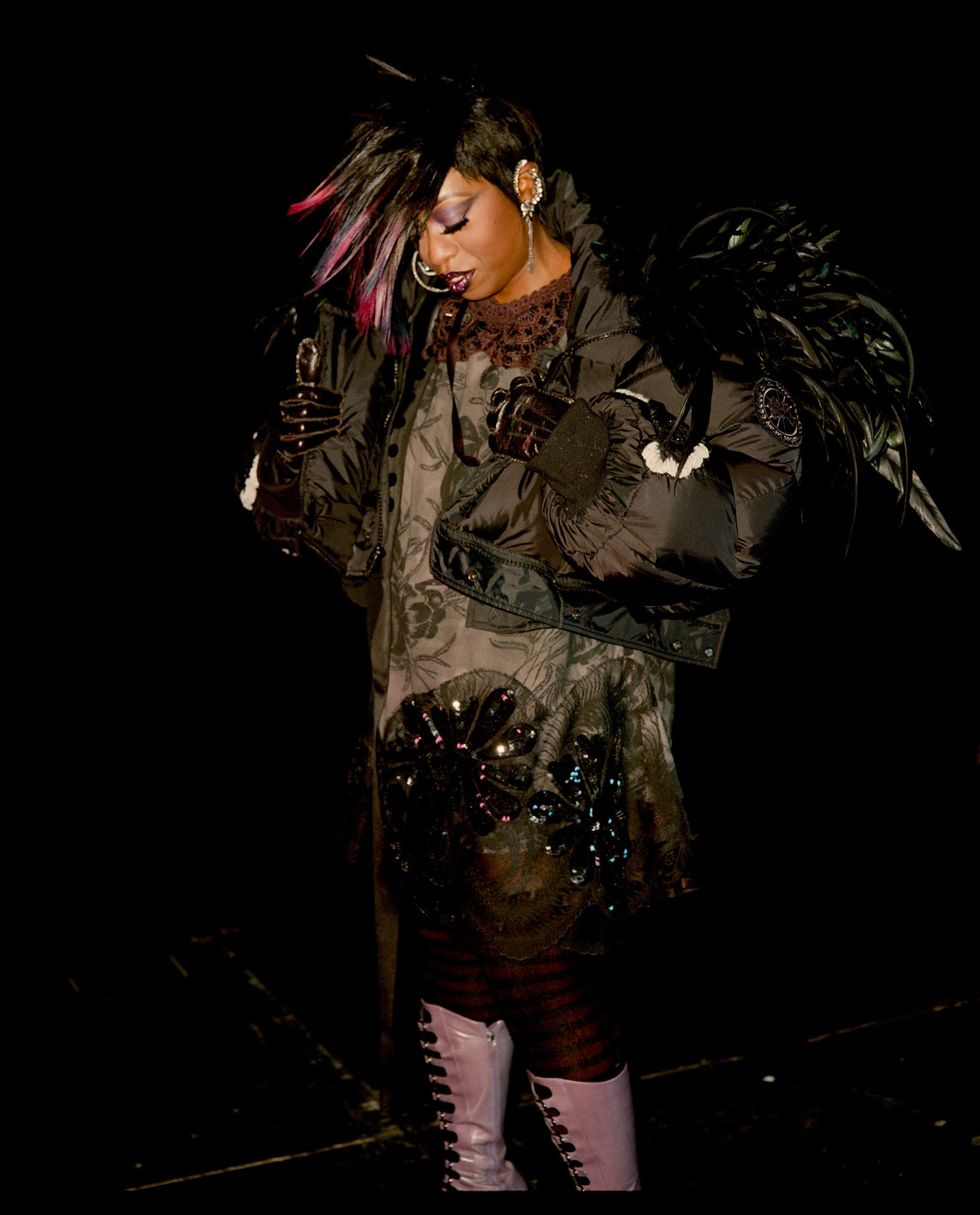 Darkness, Boot, Costume, Camouflage, Costume design, Animal product, Fashion model, 
