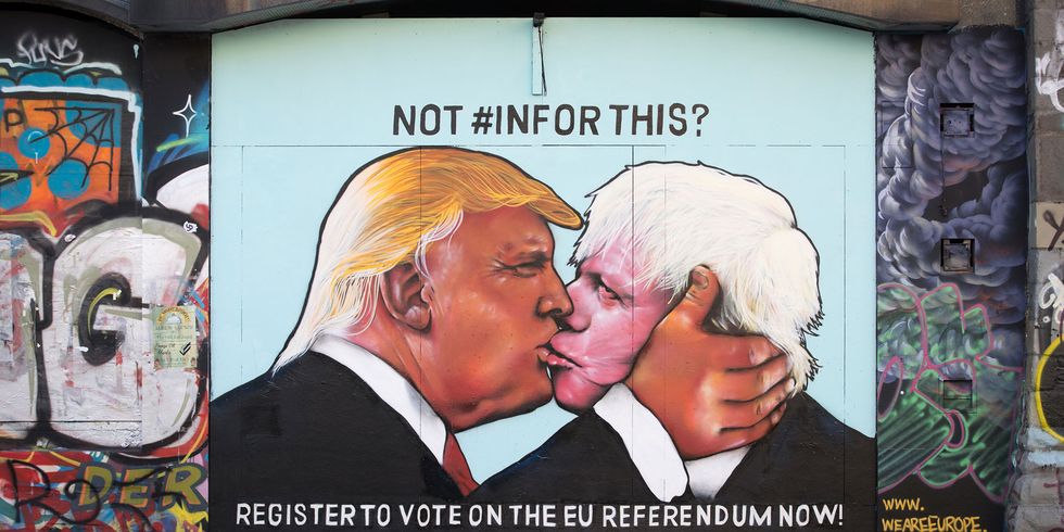 A mural showing US presidential hopeful Donald Trump sharing a kiss with former London Mayor Boris Johnson