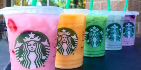 Starbucks rainbow drinks on table | ELLE UK
