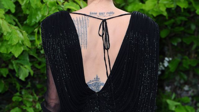 Angelina Jolie back tattoo - tattoo cover up solutions for summer