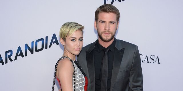 Miley Cyrus and Liam Hemsworth pose on red carpet | ELLE UK
