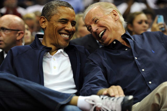 Barack Obama and Joe Biden laughing