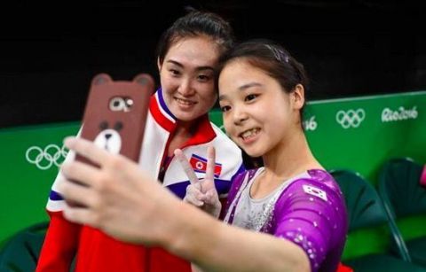 South Korean gymnast Lee Eun Ju and 2014 world champion Hong Un Jong of North Korea | ELLE UK