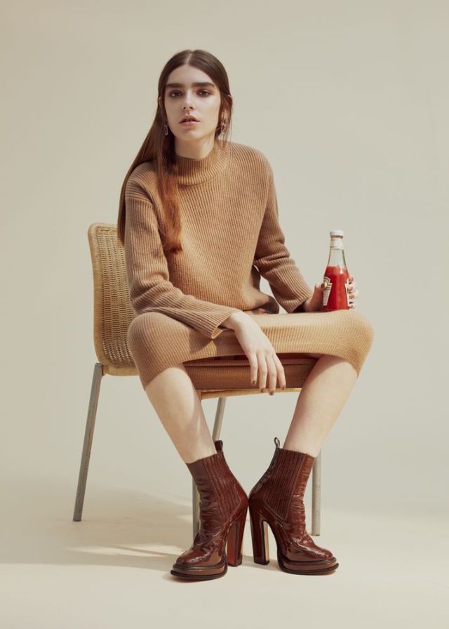 <p>Cashmere-mix jumper, £120, and matching skirt, £95, both Whistles. Patent-leather boots, £430, Carven. Silver-plated earrings, £159, Annelise Michelson</p>