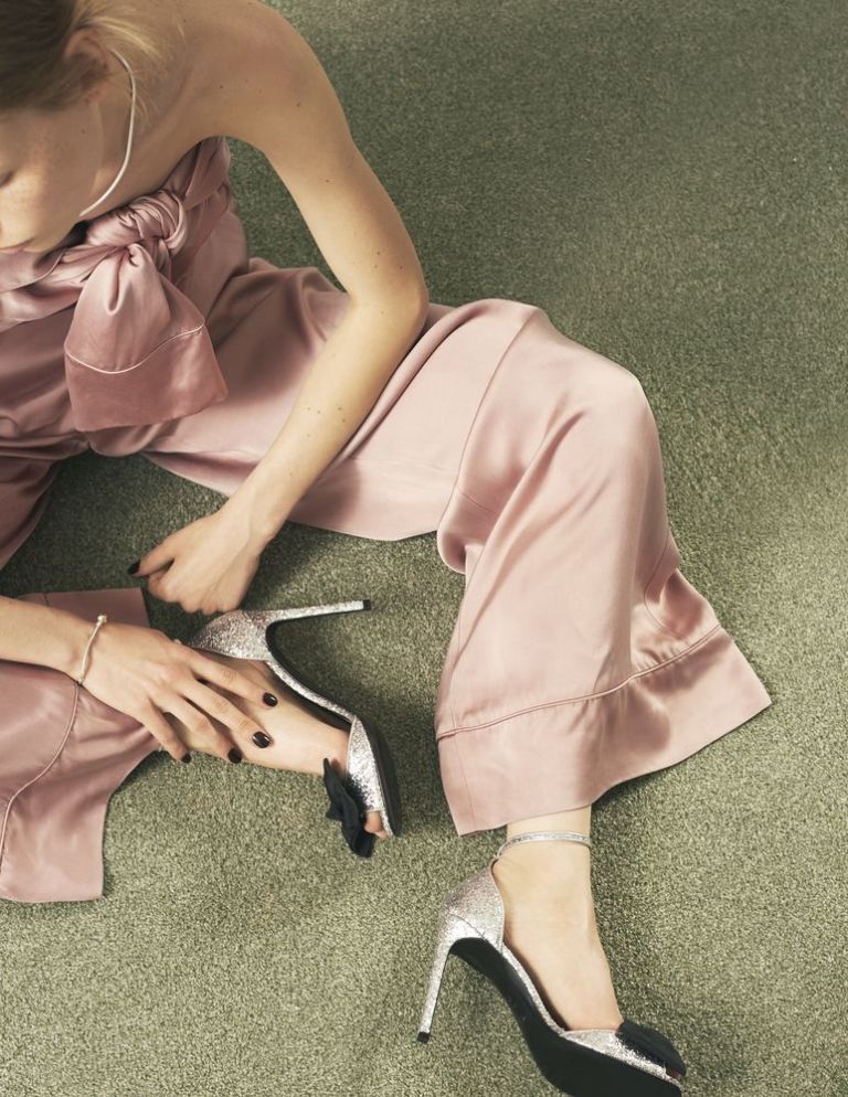 <p>Satin jumpsuit, £1,574, Zimmermann. Leather-mix sandals, £460, Saint Laurent. White-gold necklace, £2,485, white-gold bracelet, £950, and sterling  silver ring, £60, all Pandora</p>