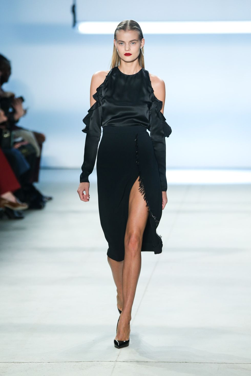 <p>Silky flamenco ruffles, cut out shoulders and a skirt slashed to the thigh banishes any feeling that frills mean frump. </p>
