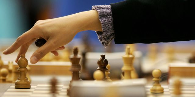 Woman playing chess | ELLE UK
