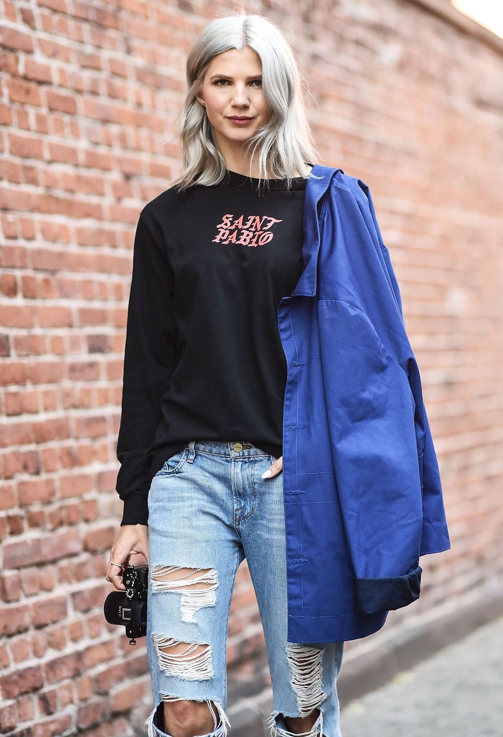 <p>Basic tees were one of the most dressed-down trends spotted outside the shows. Whether vintage or paying homage to a pop star, there's a version for everybody.</p>