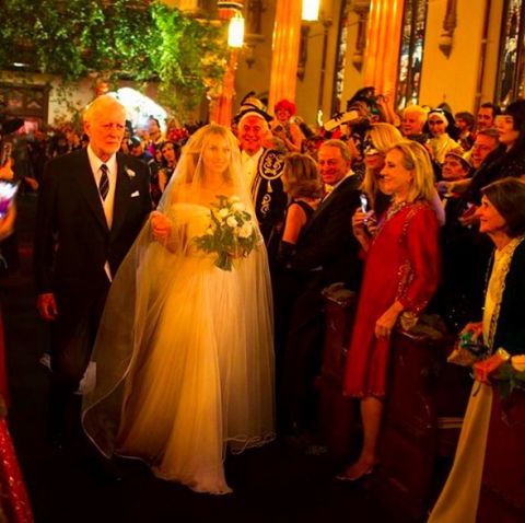 Event, Bridal veil, Veil, Suit, Formal wear, Bridal clothing, Tradition, Petal, Bride, Wedding dress, 