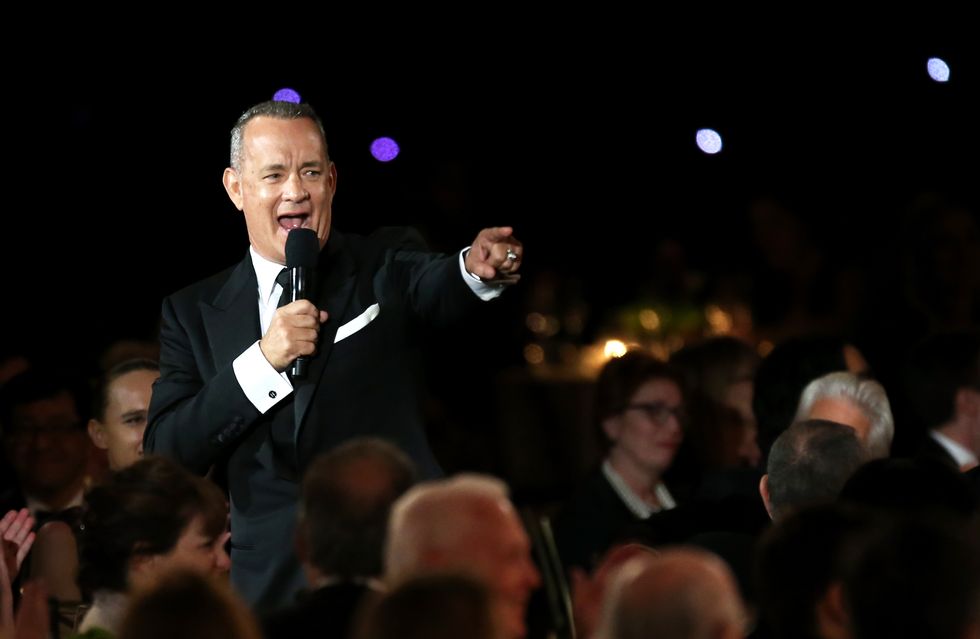 Tom Hanks with microphone | ELLE UK
