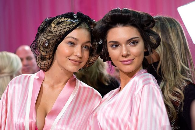 Gigi Hadid and Kendall Jenner backstage in robes and curlers at Victoria Secret