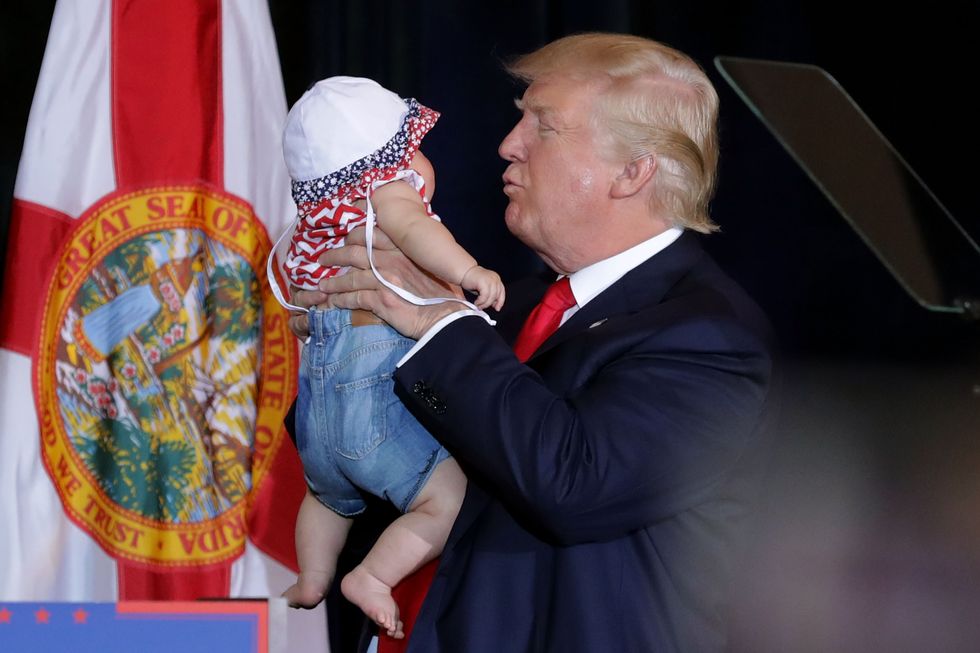 Donald Trump kisses baby | ELLE UK