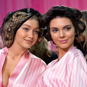 Gigi Hadid and Kendall Jenner backstage in robes and curlers at Victoria Secret