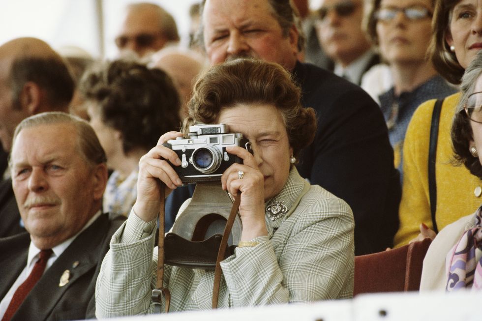 Queen Elizabeth II taking photos | ELLE UK