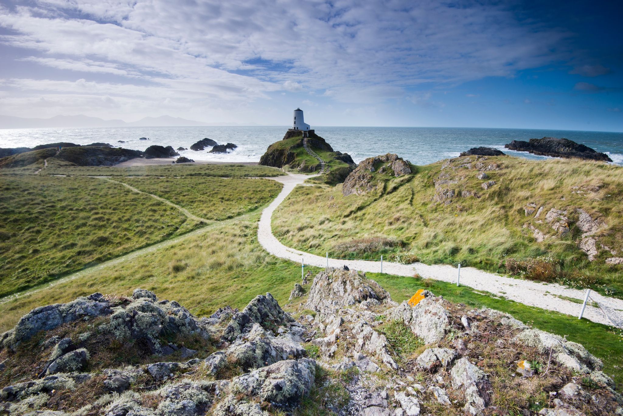 Llanddwyn Island Lighthouse on Anglesey, which contains some of the most spectacular coastline in North Wales | ELLE UK