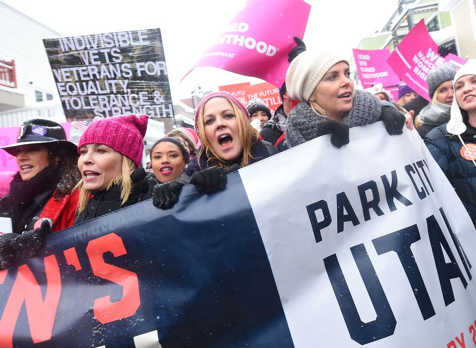 Chelsea Handler, Maria Bello, and Charlize Theron participates in the Women's March on Main Street in Park City, Utah