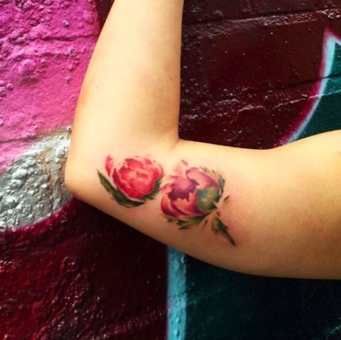 Skin, Petal, Flowering plant, Wrist, Tattoo, Insect, Rose family, Body jewelry, Arthropod, Temporary tattoo, 