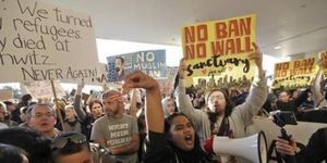 Face, Nose, Arm, Mouth, People, Social group, Crowd, Protest, Public event, Facial hair, 