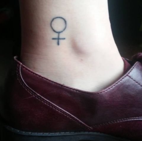 Skin, Joint, Tattoo, Purple, Muscle, Waist, Symbol, Undergarment, Leather, Temporary tattoo, 