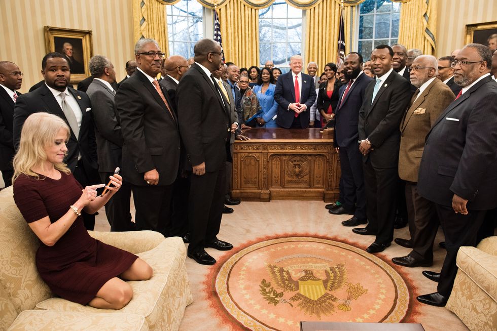 Kellyanne Conway sitting in the oval office