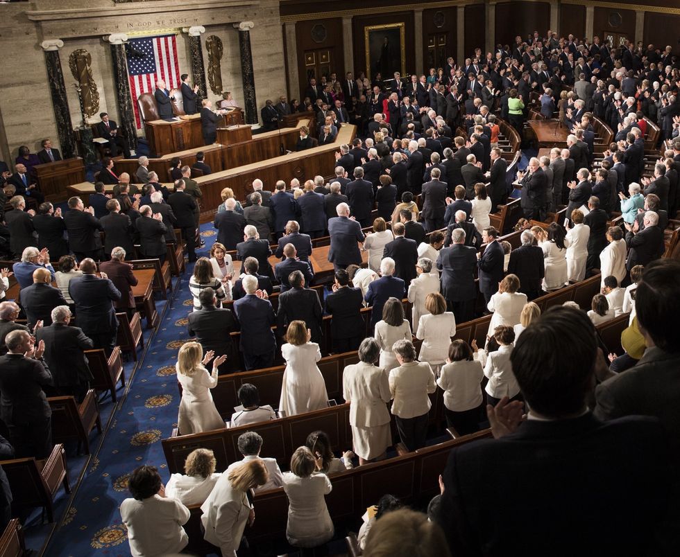 democrat women wearing white to Trump addressing nation