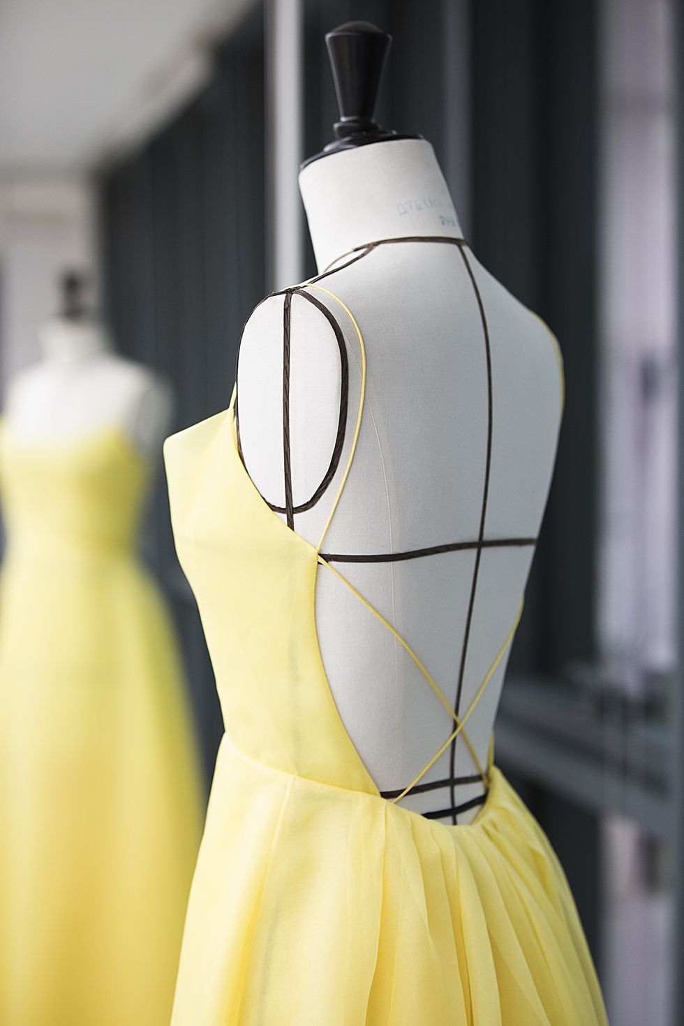 Yellow, Dress, Mannequin, One-piece garment, Fashion, Day dress, Fashion design, Pattern, Artifact, 