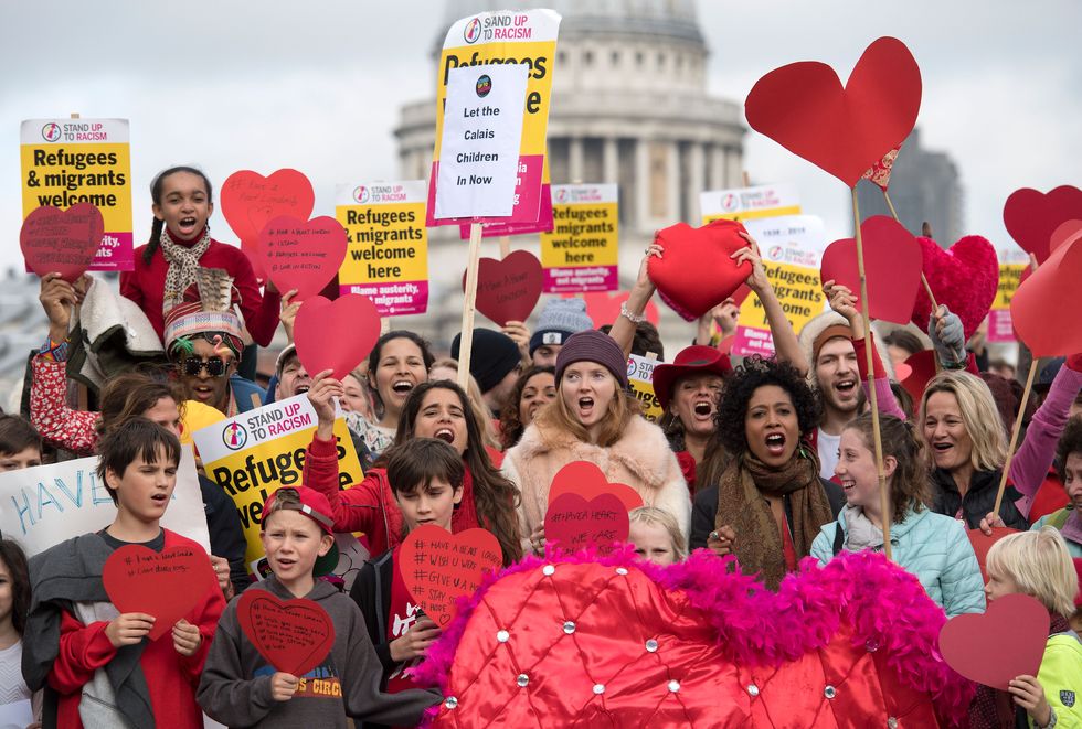 British model and actress Lily Cole (C) joins a Love In Action Have a Heart photocall on the Millennium Bridge