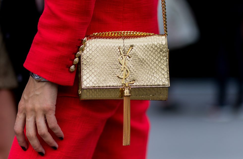 Street style details: yves saint laurent cross body bag in gold with tassle
