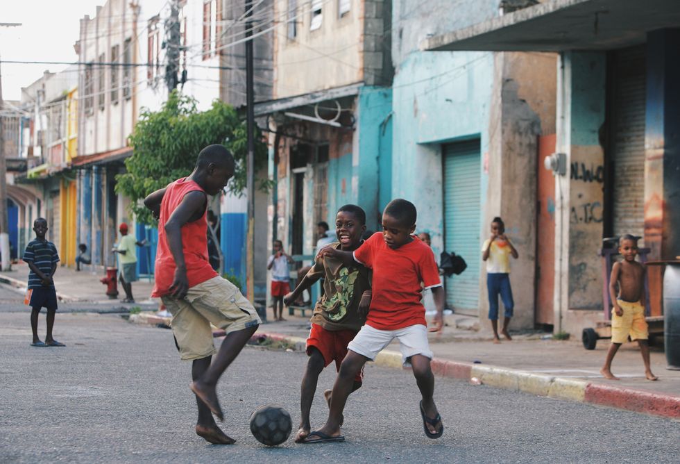 Children playing football Jamaica