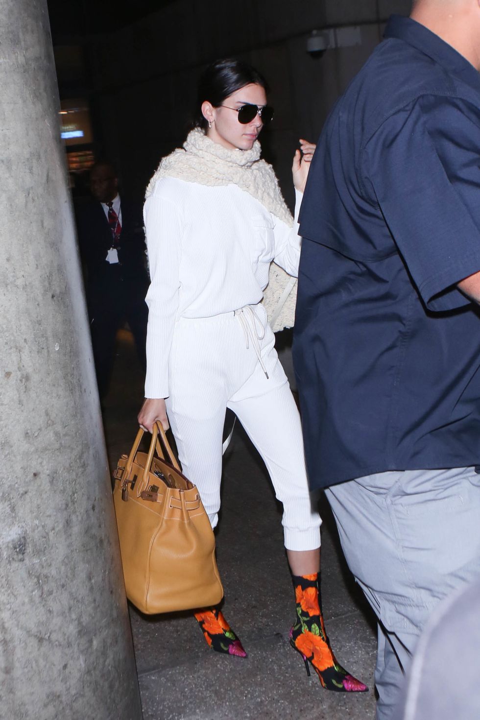 Kendall Jenner wears Balenciaga floral boots in airport