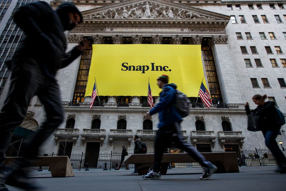 Signage for Snap Inc., parent company of Snapchat, adorns the front of the New York Stock Exchange in New York City | ELLE UK