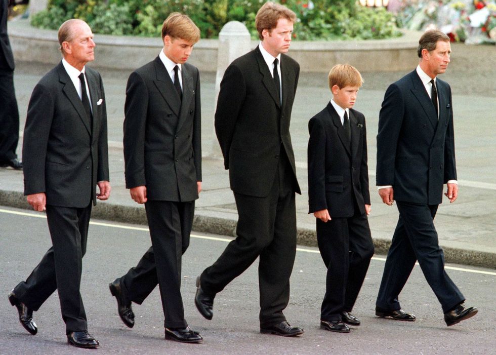 The Duke of Edinburgh, Prince William, Earl Spencer, Prince Harry and Prince Charles walk outside Westminster Abbey during the funeral service for Diana, Princess of Wales, 06 September | ELLE UK