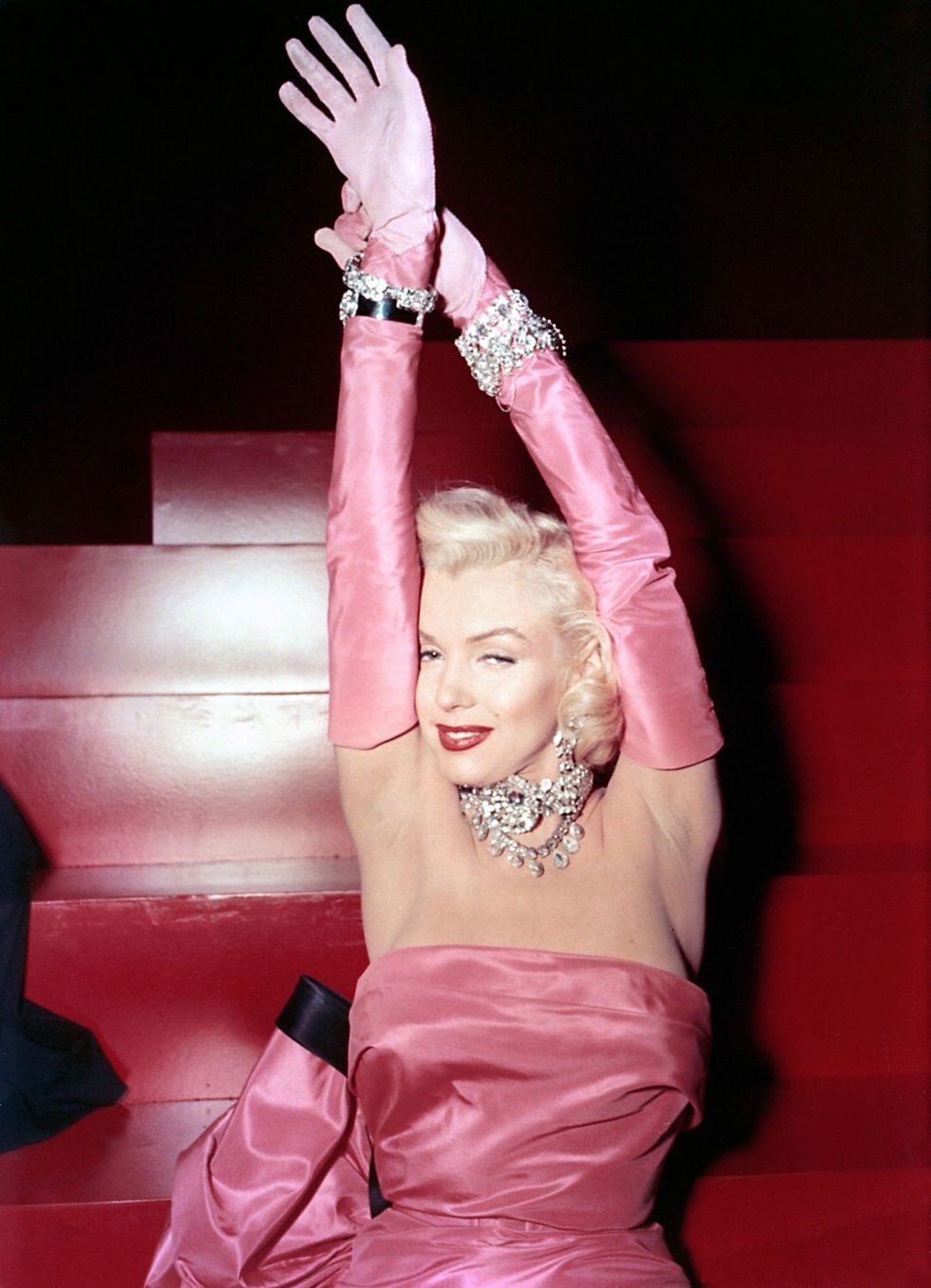 <p>Pretty in pink while singing "Diamonds Are a Girl's Best Friend," in the 1953 film <em data-redactor-tag="em">Gentlemen Prefer Blondes.</em></p>
