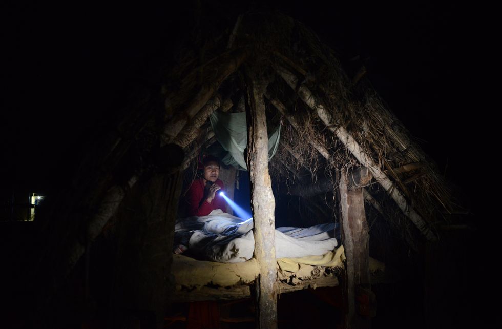 A Nepalese Woman Banished To Her Hut