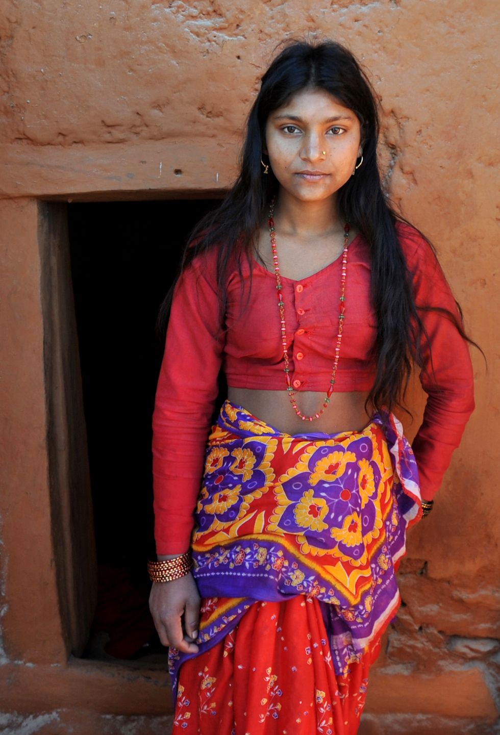 A young Nepalese woman shows her chaupadi house