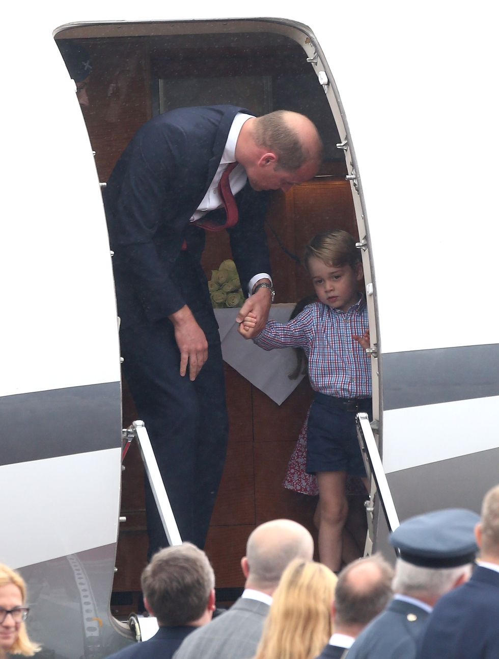 WARSAW, POLAND - JULY 17: Prince William, Duke of Cambridge and Prince George of Cambridge is seen getting off a plane during an official visit to Poland and Germany on July 17, 2017 in Warsaw, Poland