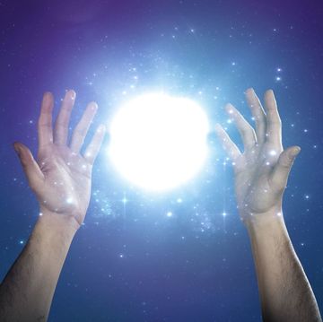 Finger, Hand, People in nature, Light, Space, Gesture, Astronomical object, Electric blue, Thumb, Lens flare, 