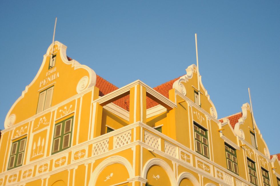 Landmark, Yellow, Architecture, Town, Building, Sky, Facade, House, City, Historic site, 